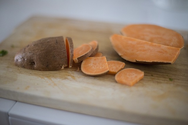golden Irish potato bread fadge slices on wooden cutting board with butter